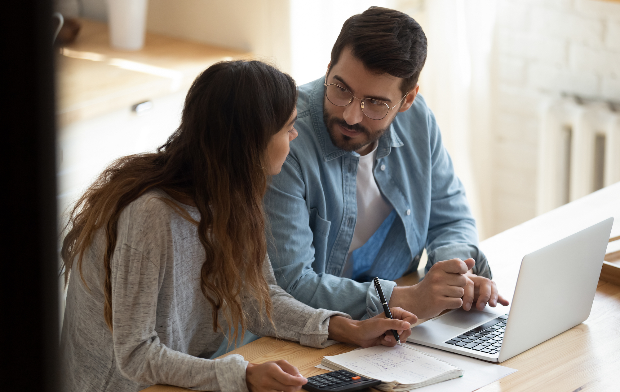 Couple reviewing finances and life insurance to prepare for recession