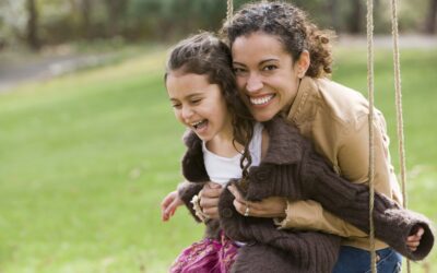 Mother and daughter on swing